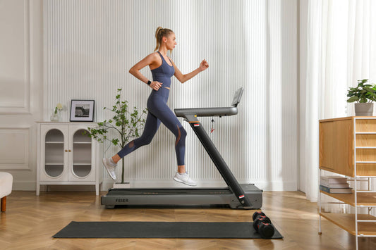 A woman is running on a treadmill at home